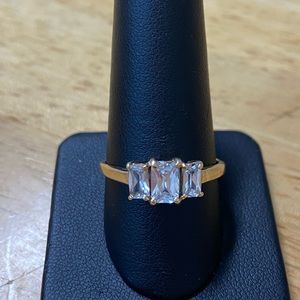 Ladies 10kt yellow gold 3 stone emerald cut CZ ring size 9 .
